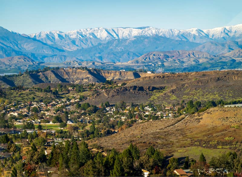 Houses in a valley surrounded by trees and mountains in Thousand Oaks.